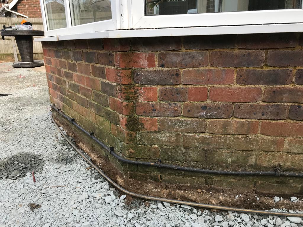 brick cleaning, brick wall that needs cleaning, precleaning of a brick wall